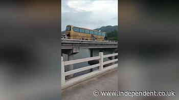 Passengers chase out-of-control bus as it rolls across bridge
