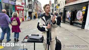 Busker fined more than £11k for street trading