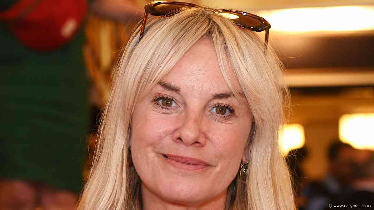 EastEnders' Tamzin Outhwaite tries to fly under the radar in hat and shades as she 'struggles to flog T-shirts and posters of herself at car boot sale'