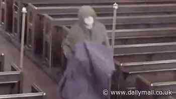 Moment shameless thief strolls into a deserted church and makes off with a £6000 brass eagle