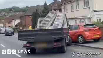 Swerving truck mounts pavement and hits cars