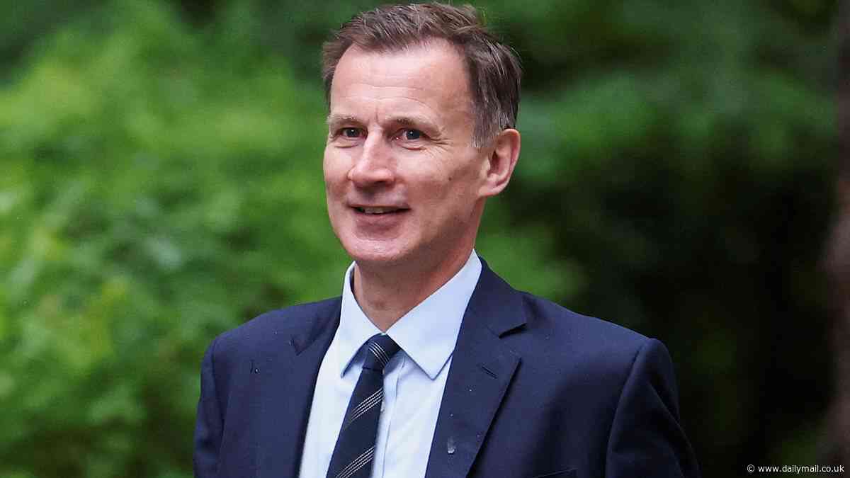 Jeremy Hunt admits he could be within 1,500 votes of becoming the first Chancellor ever to be ousted at a general election as he faces a 'Portillo moment' in his Surrey constituency