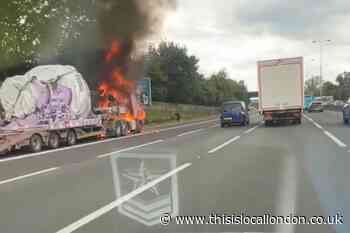 M25 Chertsey Surrey clockwise traffic stopped due to HGV fire