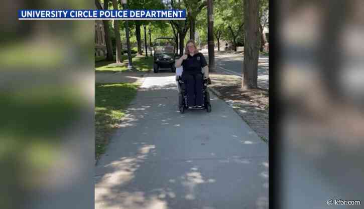 Watch: Officer rides woman's wheelchair to hospital after medical emergency