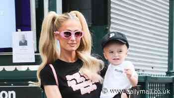 Paris Hilton, 43, dons black ensemble featuring mini-skirt and knee-high boots as she steps out with son Phoenix, one, in NYC