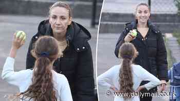 Hands-on mum Rachael Finch plays catch with her daughter before tennis lessons - after being 'personally attacked' for screaming and encouraging her at school cross-country race