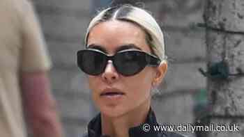 Kim Kardashian, 43, shows off her VERY smooth visage as she emerges from celeb-loved skincare center Epione in LA