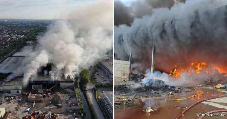 Huge fire tears through 500 tonnes of waste and shuts down roads in London