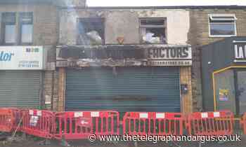 Bradford shop 'too dangerous' for firefighters to enter