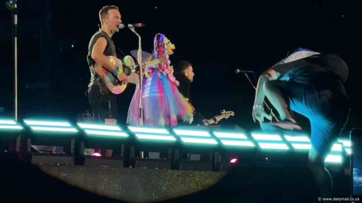 Moment Chris Martin abruptly halts live Coldplay show in Athens after Israeli flag-wearing 'comedian' falls while attempting to storm stage