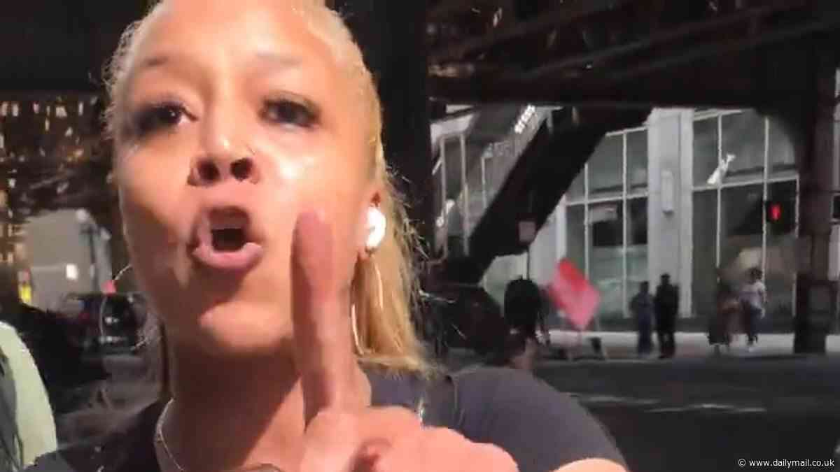 Explosive confrontation erupts on streets of Chicago as black woman accuses white man of racism for filming black man's arrest - and says her rights are 'different'