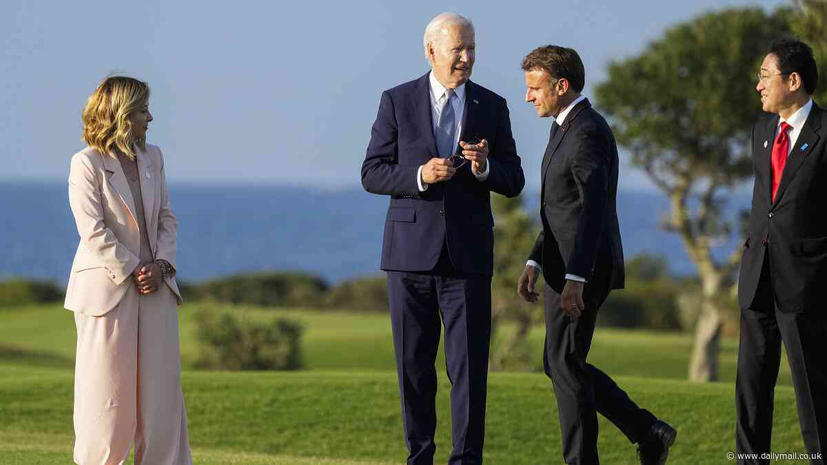Moment Italy's Giorgia Meloni has to grab Biden, 81, after he wandered away from parachute display photo op: Follow all politics stories of the day