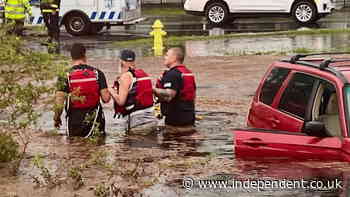 Florida driver ‘sinking in mud’ rescued by firefighters as severe weather hits state