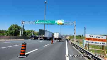 Toronto-bound lanes of QEW closed in Niagara Falls after truck hits overhead sign