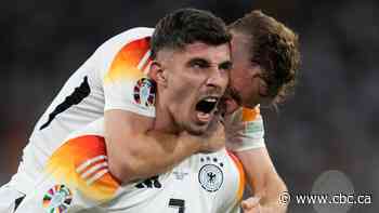 Host Germany kicks off Euro with 4-goal victory over 10-man Scotland