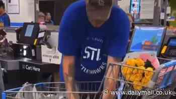 Viral video shows Missouri man not scanning a full shopping cart of items at Walmart but he says he's 'not a thief' and it's all part of his job