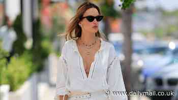 Alessandra Ambrosio flashes her cleavage in plunging blouse with shorts while stepping out in LA