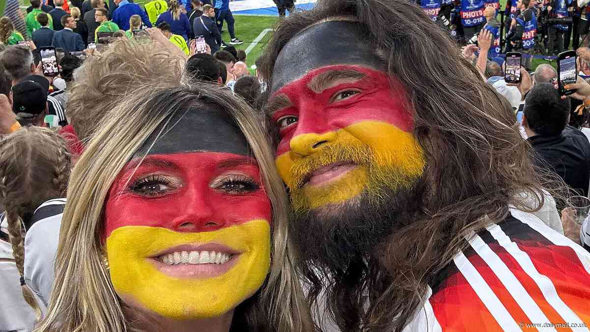 Heidi Klum shows Germany team spirit with husband Tom Kaulitz in matching face paint as she watches Germany beat Scotland for the first day of UEFA Euros