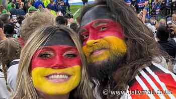 Heidi Klum shows Germany team spirit with husband Tom Kaulitz in matching face paint as she watches Germany beat Scotland for the first day of UEFA Euros