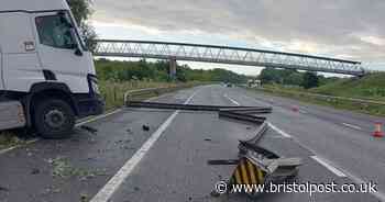 Picture shows lorry hanging off the M4 after colliding with barrier