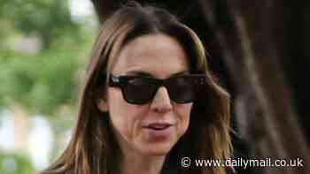 Mel C looks cosy with a mystery man as she fuels up on coffee while heading out on a dog walk