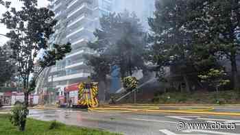 Building fire in South Vancouver causes traffic delays