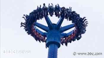 People left dangling upside down on amusement park ride