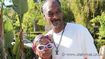 Snoop Dogg matches in pink with his high school sweetheart Shante Broadus as they celebrate 27 years of marriage