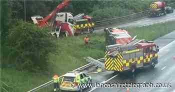 Firefighters hospitalised after vehicle overturns on M65