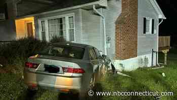 Person taken to hospital after vehicle hits house in Tolland