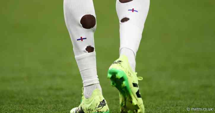 Why do football players have holes in their socks at Euro 2024?