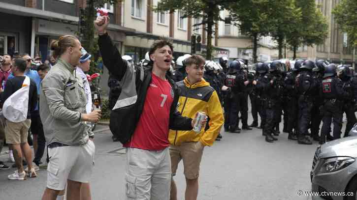 German police intervene to stem clashes between England and Serbia fans ahead of Euro 2024 match