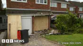 Car crashes into front of house in village