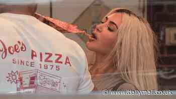 Kim Kardashian enjoys a good slice of New York pizza at North West's 11th birthday party