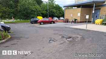 Pothole riddled hospital road fixed by local firms