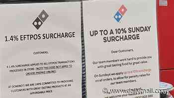 Why this sign at a Domino's has customers accusing the pizza chain of 'highway robbery'