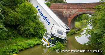 Lorry ends up in canal after early morning crash