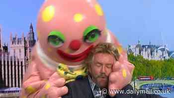 Noel Edmonds swears live on GMB as his 90s House Party sidekick Mr Blobby destroys the studio in a VERY chaotic segment - leaving host Susanna Reid forced to apologise