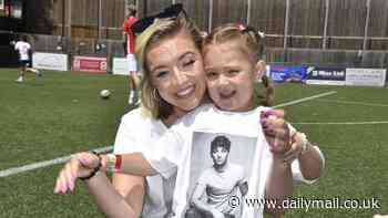 Tom Parker's daughter Aurelia, 4, follows in her father's footsteps as she performs at half time during celebrity charity football match