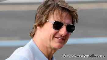 Tom Cruise appears in high spirits as he lands his helicopter at Battersea helipad following a day trip to Oxford amid Mission Impossible 8 filming