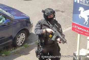 Bournemouth: Armed police spotted as helicopter circles