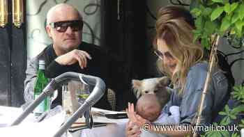 Damien Hirst, 58, is seen for the first time since welcoming his newborn son with fiancée Sophie Cannell, 30, as the family enjoy lunch at Scott's in Mayfair