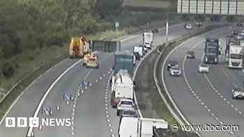 Lorry overturns on motorway sparking hour-long delays
