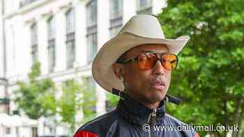 Pharrell Williams cuts a quirky figure in a cowboy hat and vibrant jacket ahead of his latest show for Louis Vuitton in Milan - after being slammed as 'out of touch' for brand's $1M bag