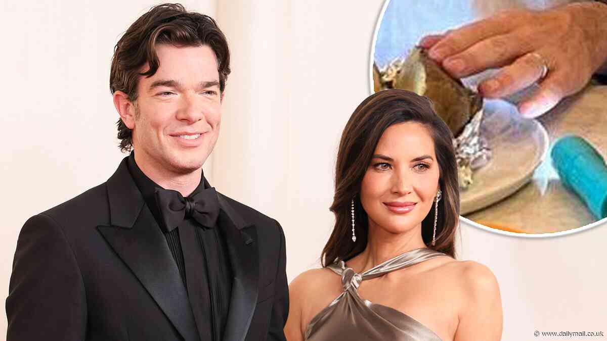 John Mulaney hints he is married to Olivia Munn as he shares a photo with a wedding band on his ring finger - then quickly takes the image down