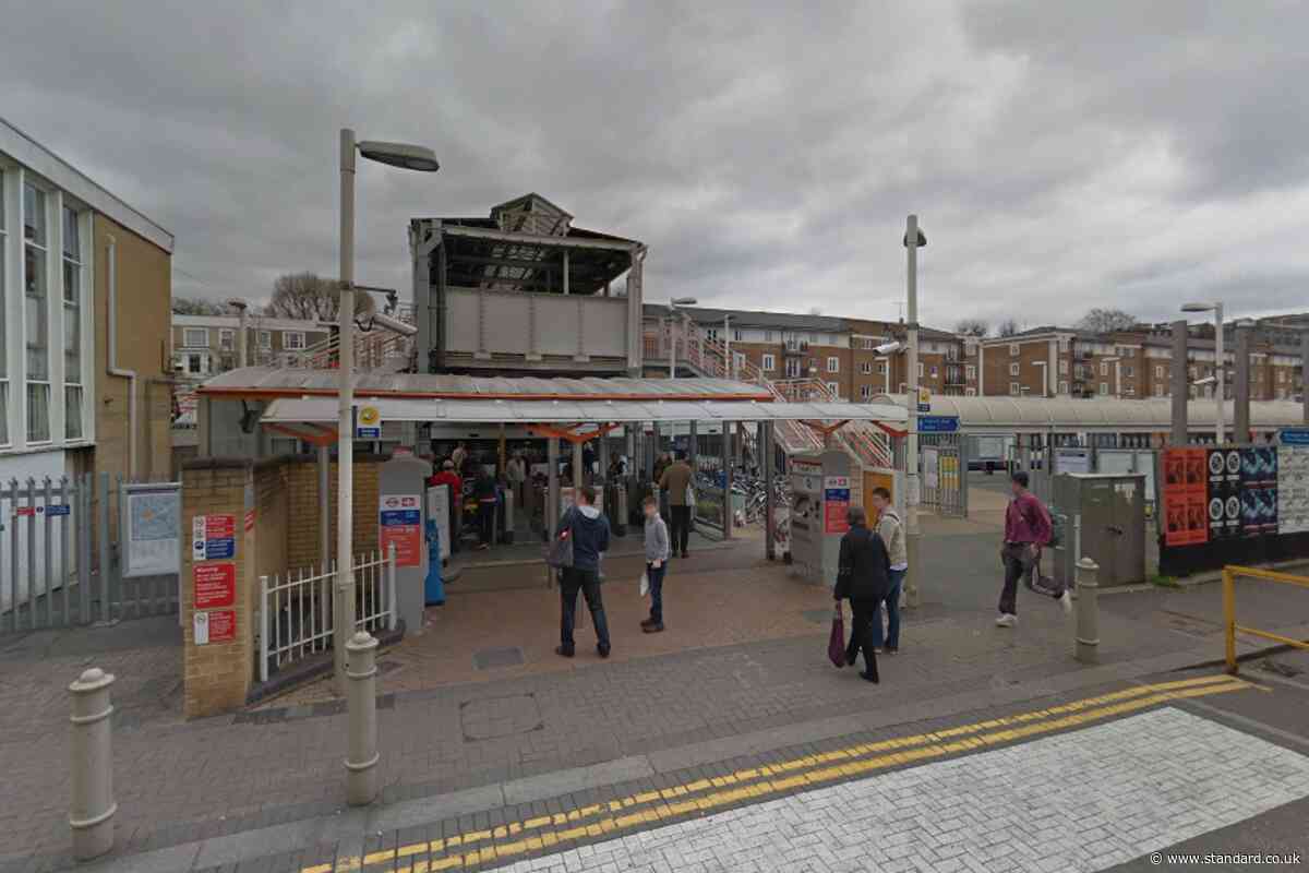 Overground trains suspended after man on roof throws objects onto track at Kensington Olympia