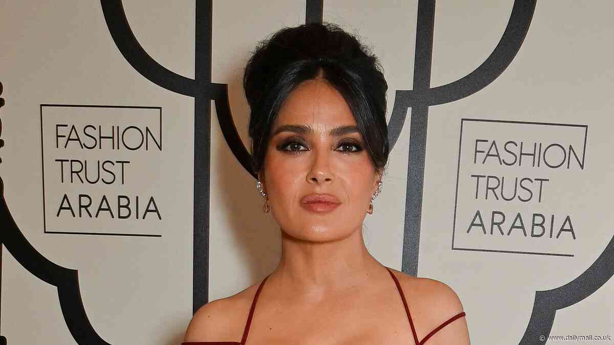 Salma Hayek, 57, puts on a very busty display in a plunging red cocktail dress as she joins abs-flashing Sabrina Elba, 35, at swanky fashion bash in London