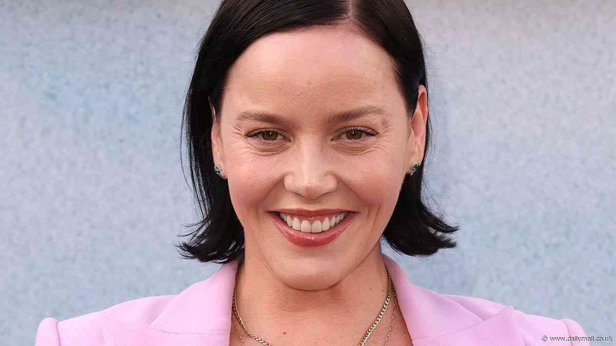 Abbie Cornish ditches Anna Nicole Smith's blonde wig as the brunette takes a break from filming late star's biopic to step out on red carpet at The Bikeriders premiere in LA