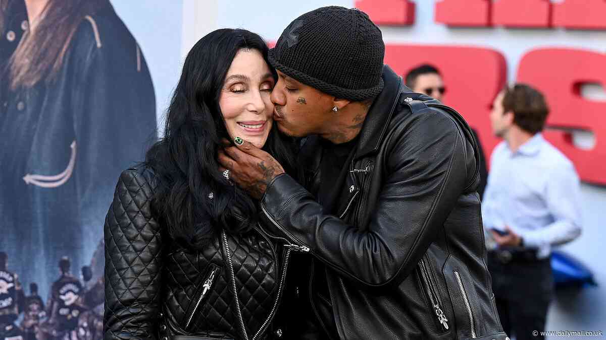 Cher, 78, packs on the PDA with boytoy Alexander Edwards, 38, as they pose on the red carpet at The Bikeriders premiere in LA