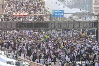 Muslim pilgrims warp up Hajj with final symbolic stoning of the devil and final circling of Kaaba
